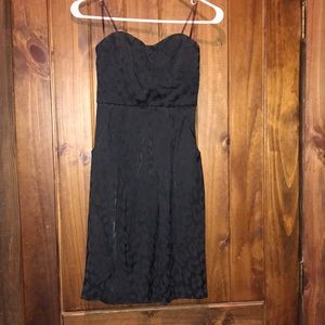 Strapless black dress.